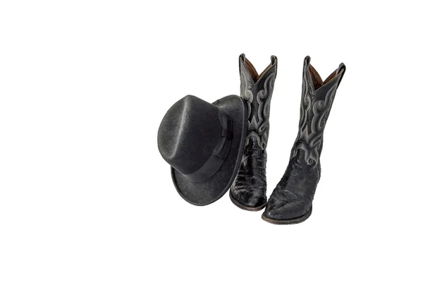 Um par de botas de cowboy preto fantasia com um homburg feltro preto — Fotografia de Stock