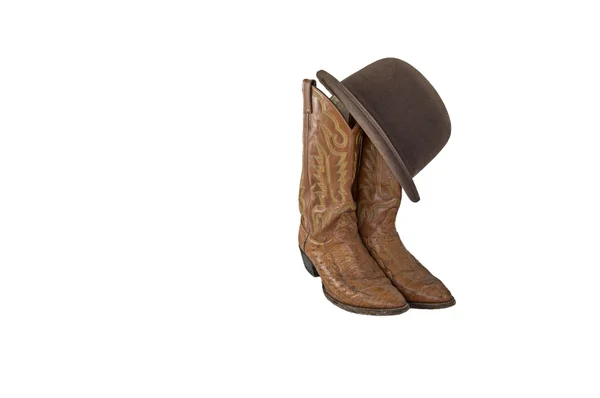 Botas de cowboy marrom extravagante e um derby marrom — Fotografia de Stock