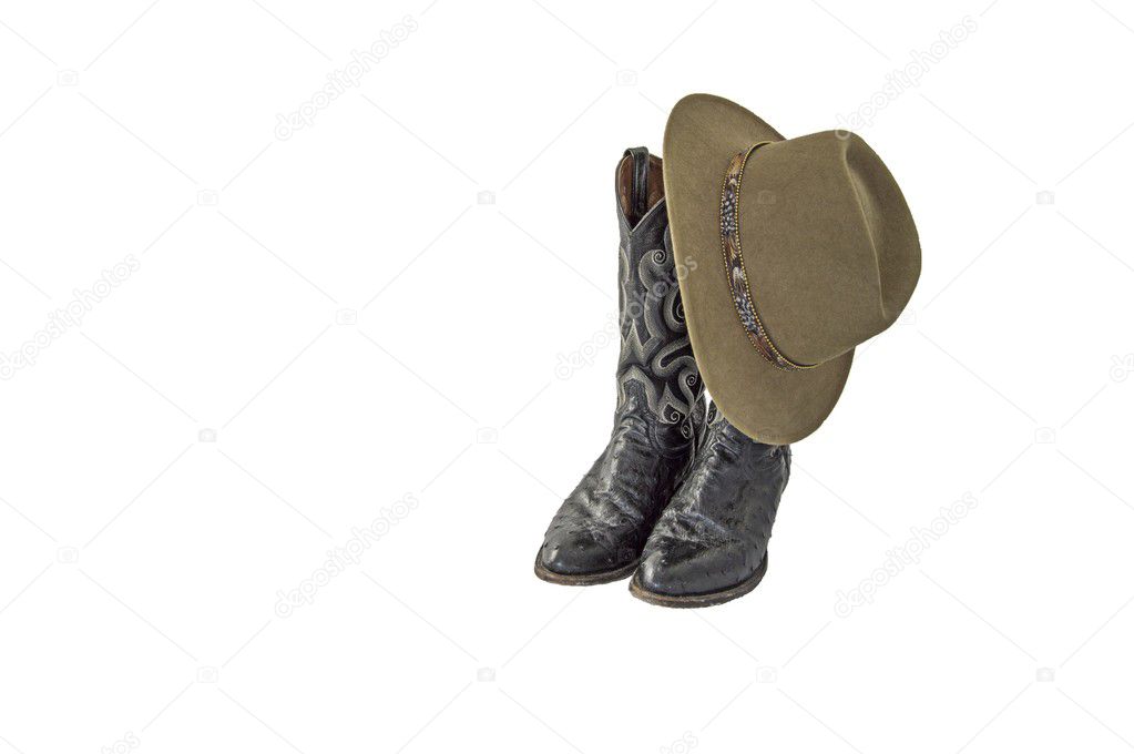 A pair of fancy black cowboy boots with a green felt outback hat