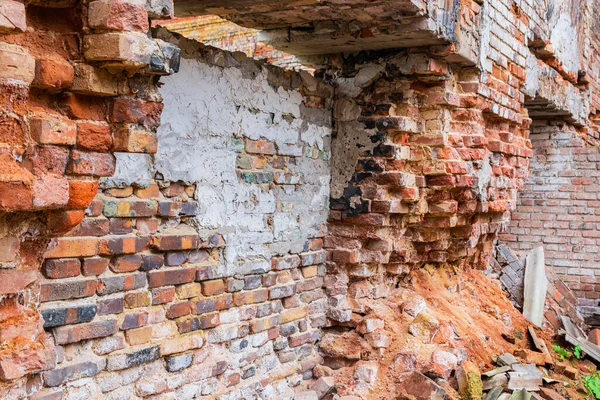 The inner brick wall of the building of an old glass factory of the 19th century, built in the Baroque style in the Siberian outback in the Krasnoyarsk Territory.