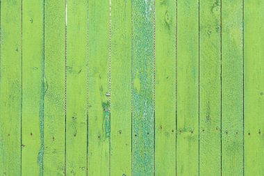 Eski yeşil ahşap bir tahtanın yüzeyi. Tahtalar dikey..