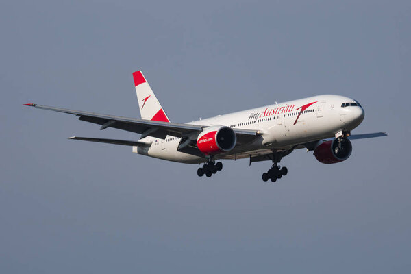 Austrian Airlines Boeing 777-200 OE-LPD passenger plane arrival and landing at Vienna Airport