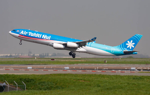 Air Tahiti Nui Airbus A340-300 F-OSUN passenger plane departure and take off at Paris Charles de Gaulle Airport