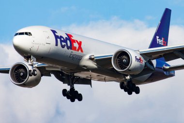 Fedex cargo plane at airport. Schedule flight travel. Aviation and aircraft. Air transport. Global international transportation. Fly and flying. Arrival and landing. clipart