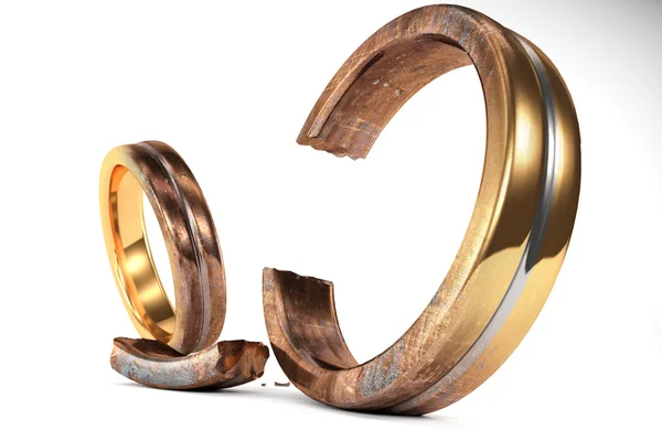 Rezavý snubní prsteny symbolizující rozvodu mezi dvěma lidmi — Stock fotografie