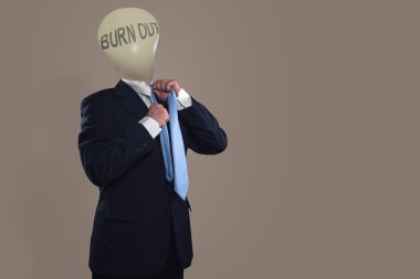 Symbol of a businessman with burn out syndrome clipart