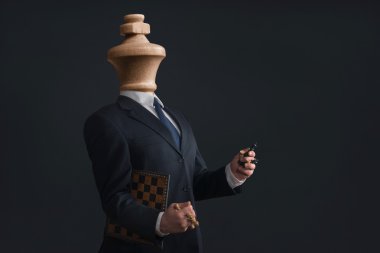 Symbol of a narcissist without head and with pawns in the hands clipart