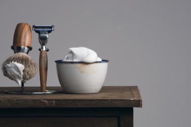 vintage Shaving Equipment on blue wooden Table clipart