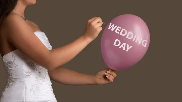 Bride lets a Balloon with Text burst with a needle — Stock Photo, Image