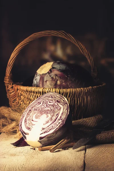 Fresh red cabbage on a table in a warm kitchen — Stock Photo, Image