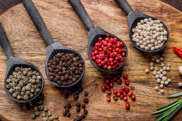 Black Wooden Spoons Colorful Balls Spices — Stock Photo, Image