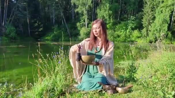 Yogi Woman Nature Holds Singing Massage Cup Which Mantra Mani — Stock Video