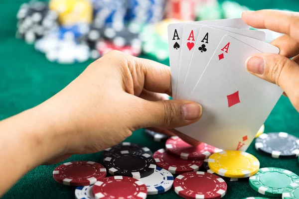 Gambling Hand Holding Best Game Card Series and Money Chips — Stock Photo, Image