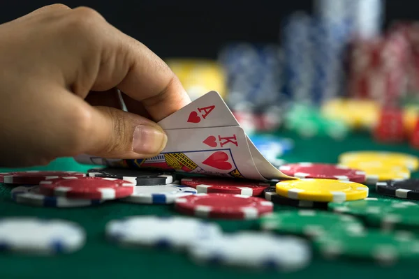 Gambling Hand Holding Best Game Card Series and Money Chips — Stock Photo, Image