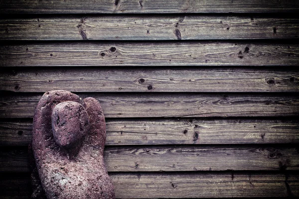 Stone Lady Sculpture on Wooden Wall — Stock Photo, Image