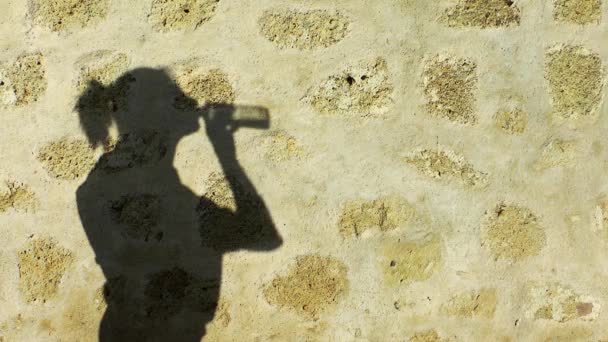 Woman Shadow Drinking Water from Bottle — Stock Video