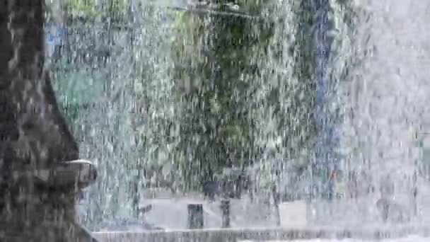 City Lifestyle Behind Waterfall Fountain — Stock Video