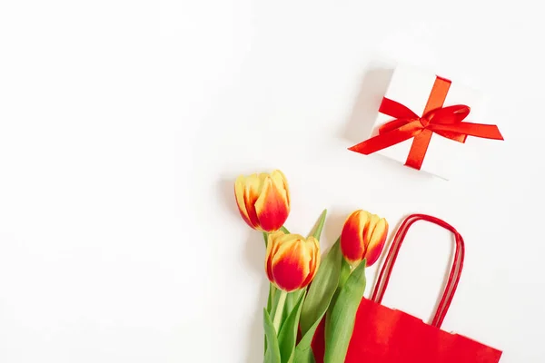 Flat Lay Composition Red Yellow Tulips Red Paper Bag Gift — Stock Photo, Image