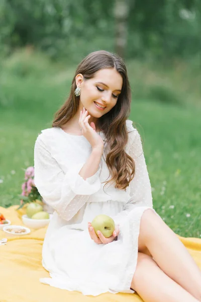 Happy Smiling Girl Holds Apple Her Hands Sits Yellow Blanket — Stock Photo, Image