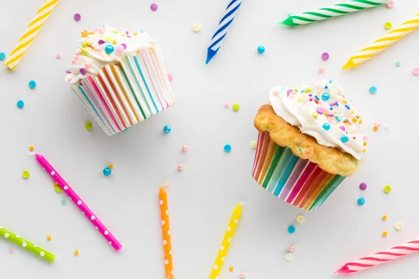 Flat lay collage of confetti cupcakes and candles for a birthday celebration.