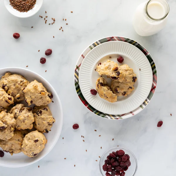 Top down view of homemade cranberry flax breakfast cookies with a bottle of milk, ready for eating. — Stock Photo, Image