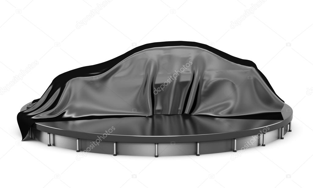 Car on the podium covered with a black satin cloth before presen