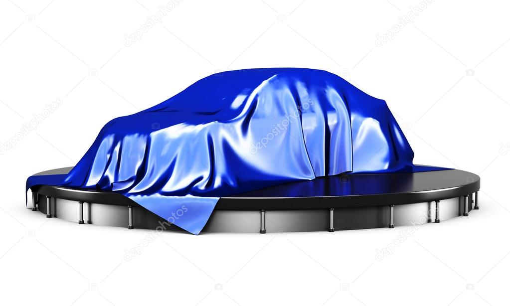 Car on the podium covered with a blue satin cloth before present