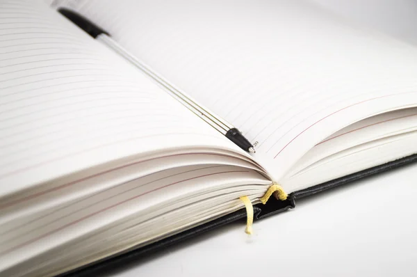 Open notebook with bookmark and pen — Stock Photo, Image