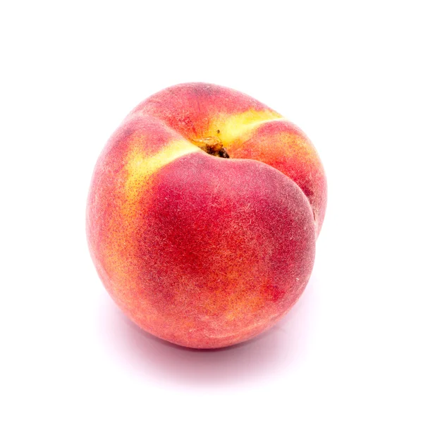 Bright juicy peach on a white background — Stock Photo, Image