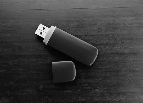 Unità USB nera su uno sfondo di legno nero. 3d . — Foto Stock