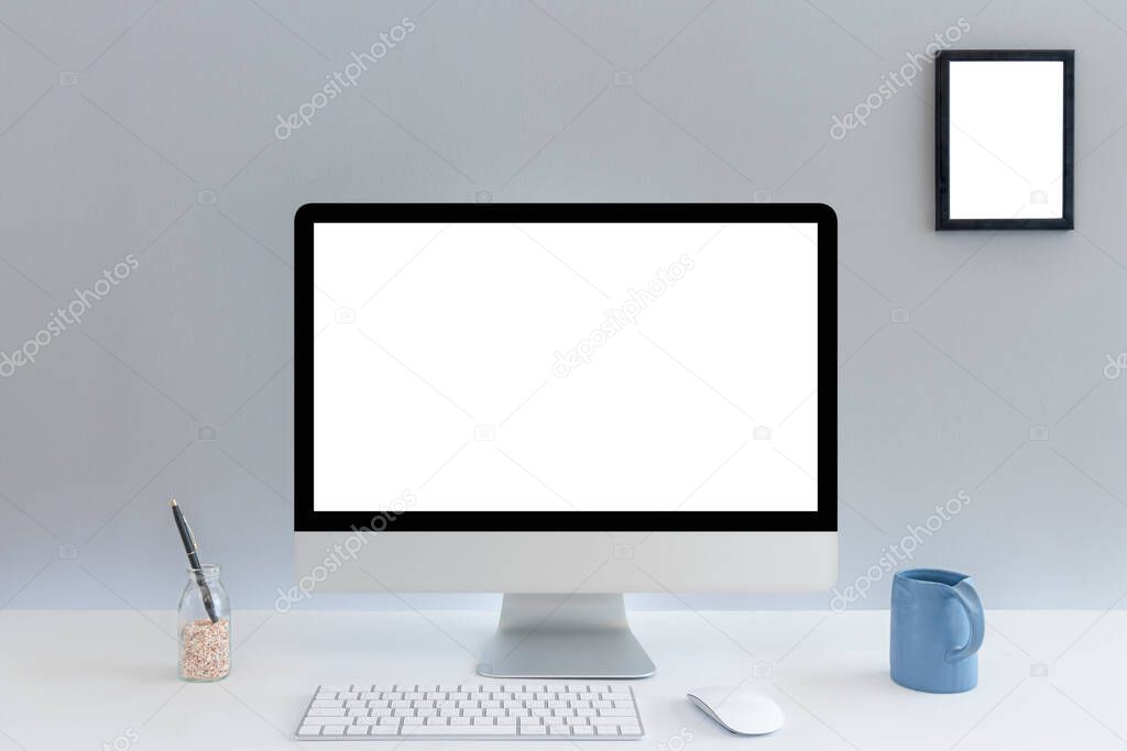 Computer with blank white copy space for text, Mockup design desktop computer in office on white table with keyboard and Coffee cub, Work place concept.