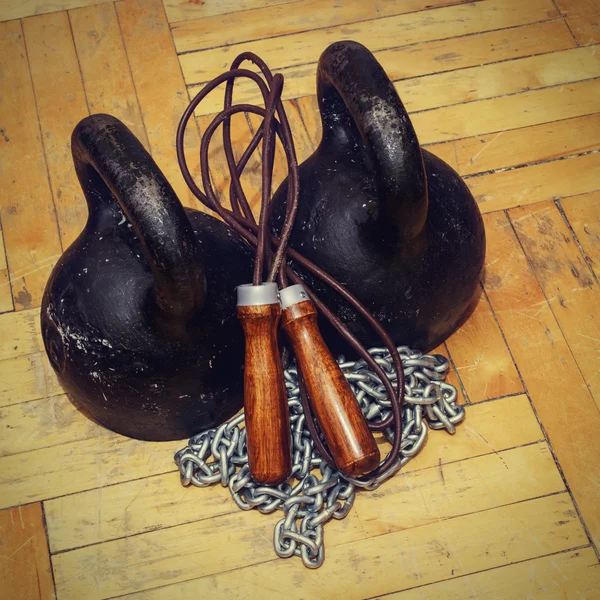 Cast iron kettlebell, chain and leather jump rope