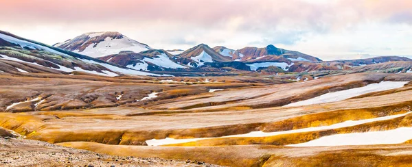 Rainbow mountains and fields of snow — Stock Photo, Image