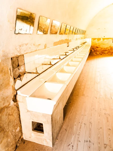 Old mass bathroom in prison — Stock Photo, Image