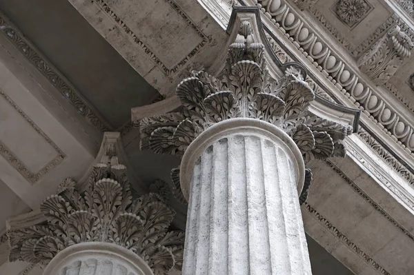 Classic architectural column. Details of the architecture of a historical building. Element of exterior building with columns and Stucco molding on the ceiling of Cathedral in St. Petersburg, Russia.