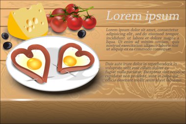 D bir beyaz tabakta bir kalp şeklinde sosisli omlet