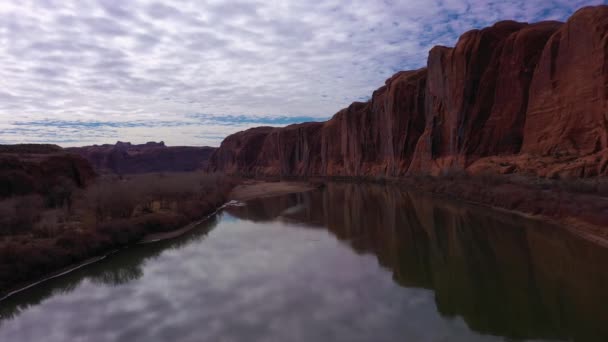 Colorado River and Red Sandstone Cliffs on Cloudy Day. Utah, USA. Aerial View — Stock Video