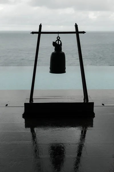 Metal bell in temple on the seaside.