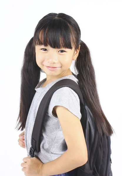 Little asian girl holding the books with her backpack — Stock Photo, Image