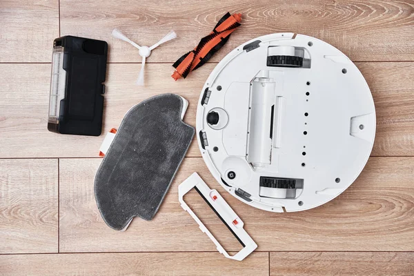 Repair robot vacuum cleaner, close up. Household appliance service