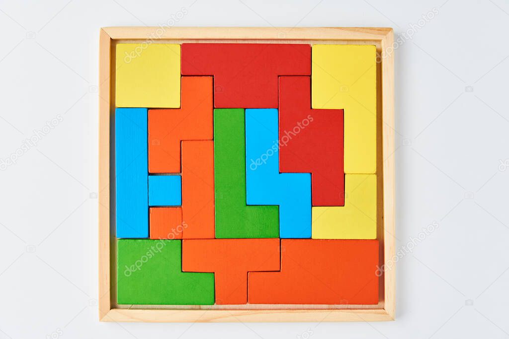 Different wooden blocks on a white background. Concept of logical thinking and education