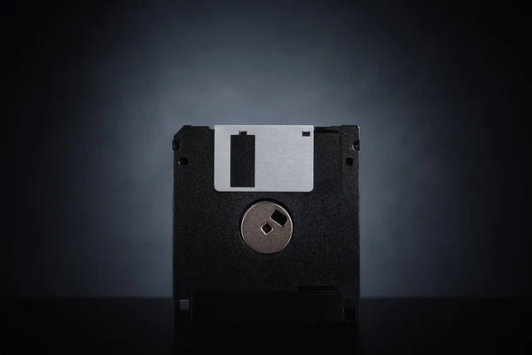 Floppy disk on dark background