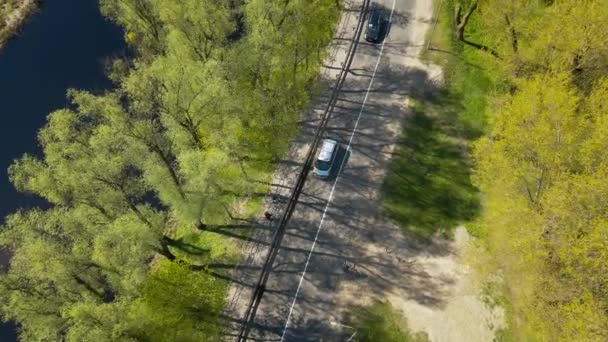 Car moving on the road in europe small town, aerial view — Stock Video