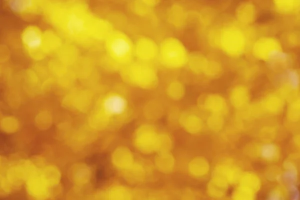 Fondo borroso abstracto de color oro — Foto de Stock