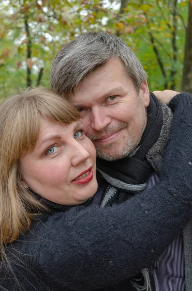 Portrait Loving Middle Aged Couple Autumn Park Woman Hugging Gray — Stock Photo, Image