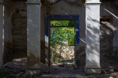 Old Abandoned House, Without Door Entry. Entrance in the abandoned old brick house without the door. No people