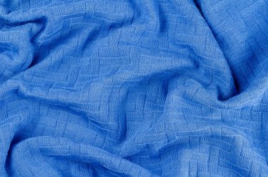 Buruşuk mavi kumaş arka plan. Buruşuk kazak. Günlük kıyafet. Soyut arkaplan.