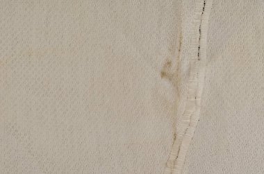 Buruşmuş beyaz kirli bez. Eski lekeli kumaş tam kare. Soyut arkaplan.