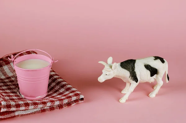 Figurine Toy Cow Bucket Milk Pink Background White Animal Black — Stock Photo, Image