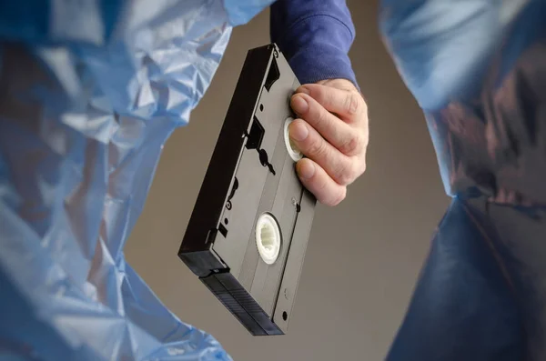 Hand Throws Videotape Trash Man Holds Black Old Storage Medium — Stock Photo, Image